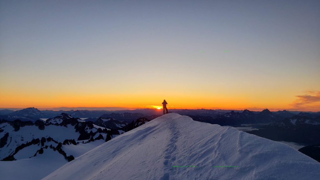 climber at sunrise eldorado peak