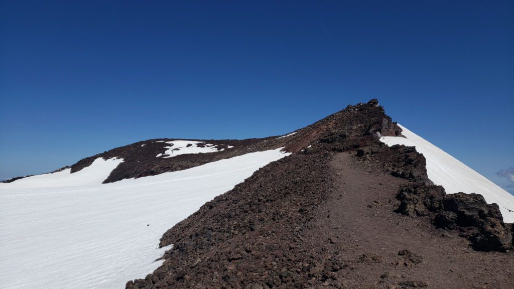 south sister climbers trail along the crater rim
