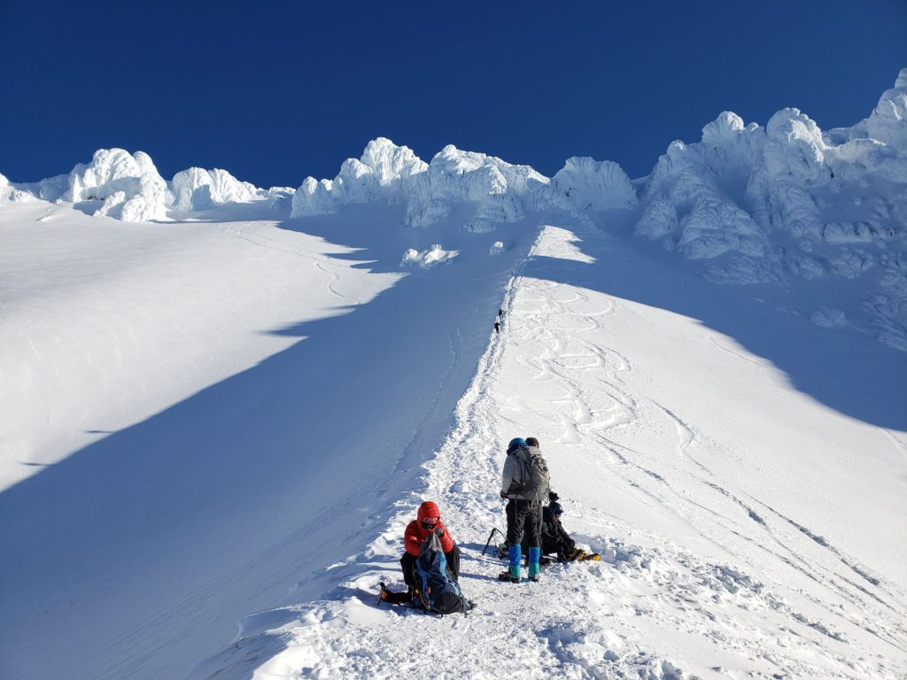 climbers at the bottom of the hogsback on mount hood