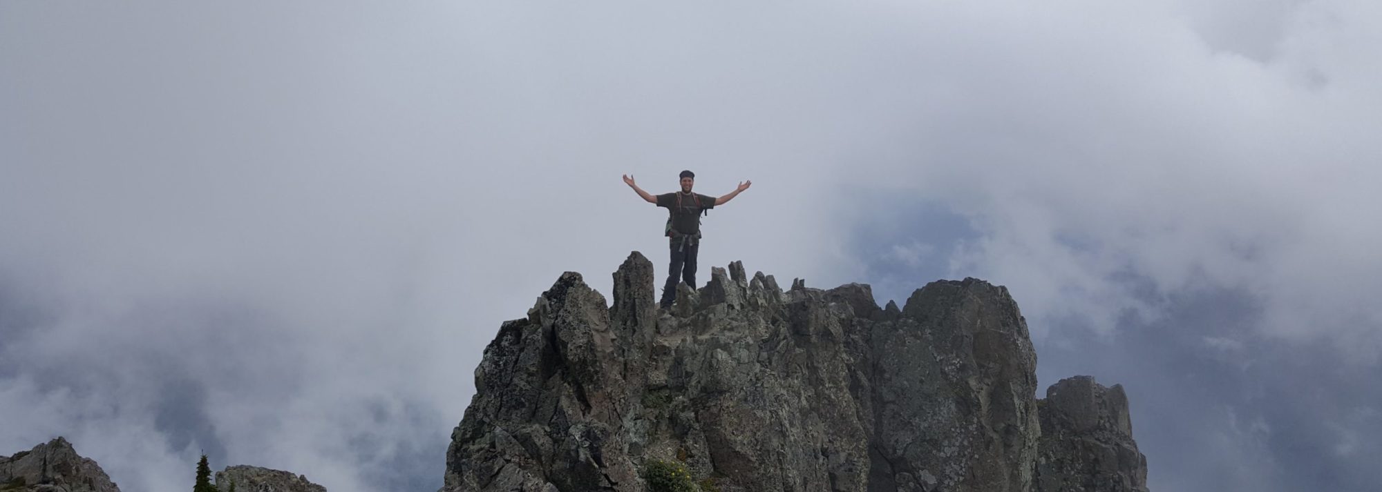 brandon standing on the summit of mount forgotten