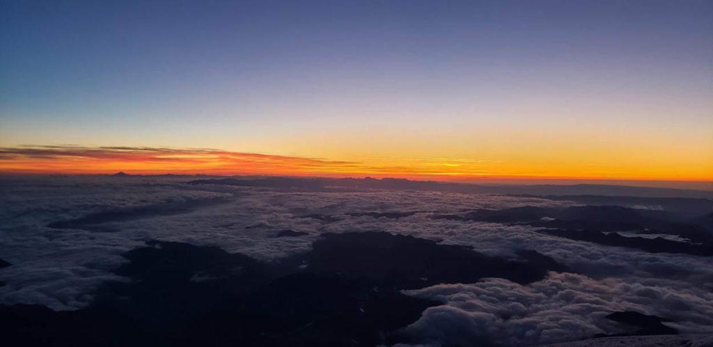 sunrise from 13500 feet on mount rainier